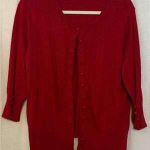 Red Cardigan with covered buttons.